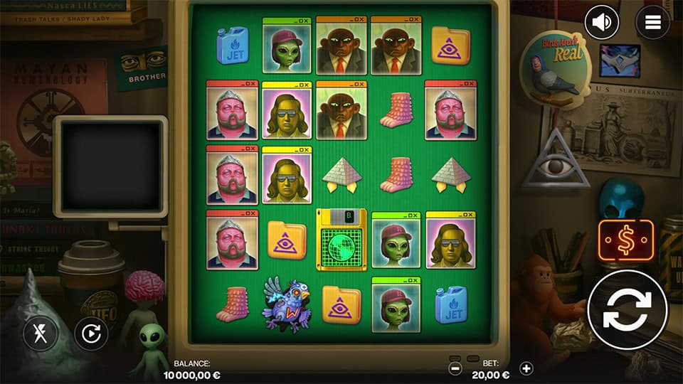Gameplay on a vintage green computer screen featuring alien characters, pyramids, socks, and secret agents, surrounded by strange paraphernalia.