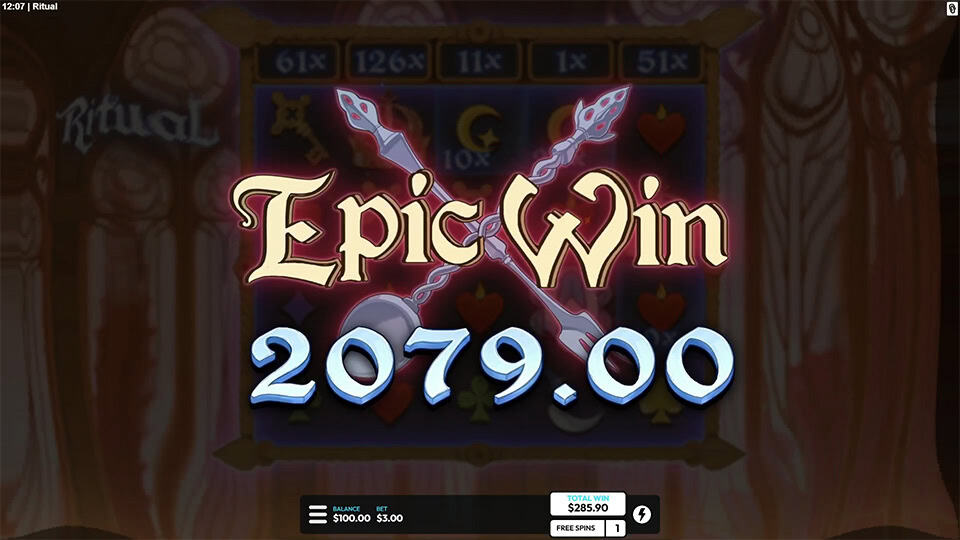Epic Win display in Ritual slot with crossed spears and glowing 2079.00 win text over blurred reels, emphasizing a big payout moment.