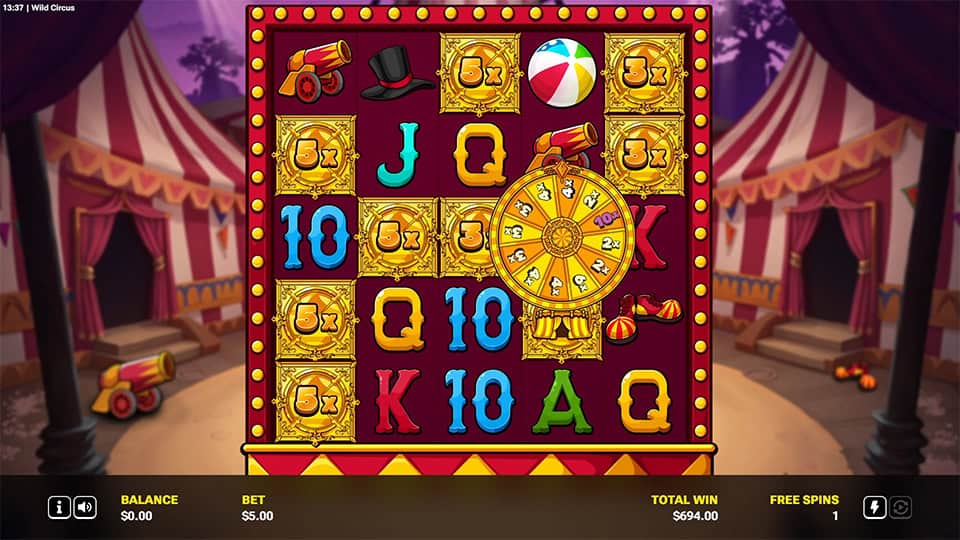 Free spins round in Wild Circus featuring a large golden prize wheel and reel symbols with visible multipliers.